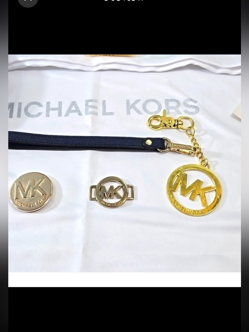 Michael Kors 5pc accessories bundle dust bag. New wristlet strap. Bag charms